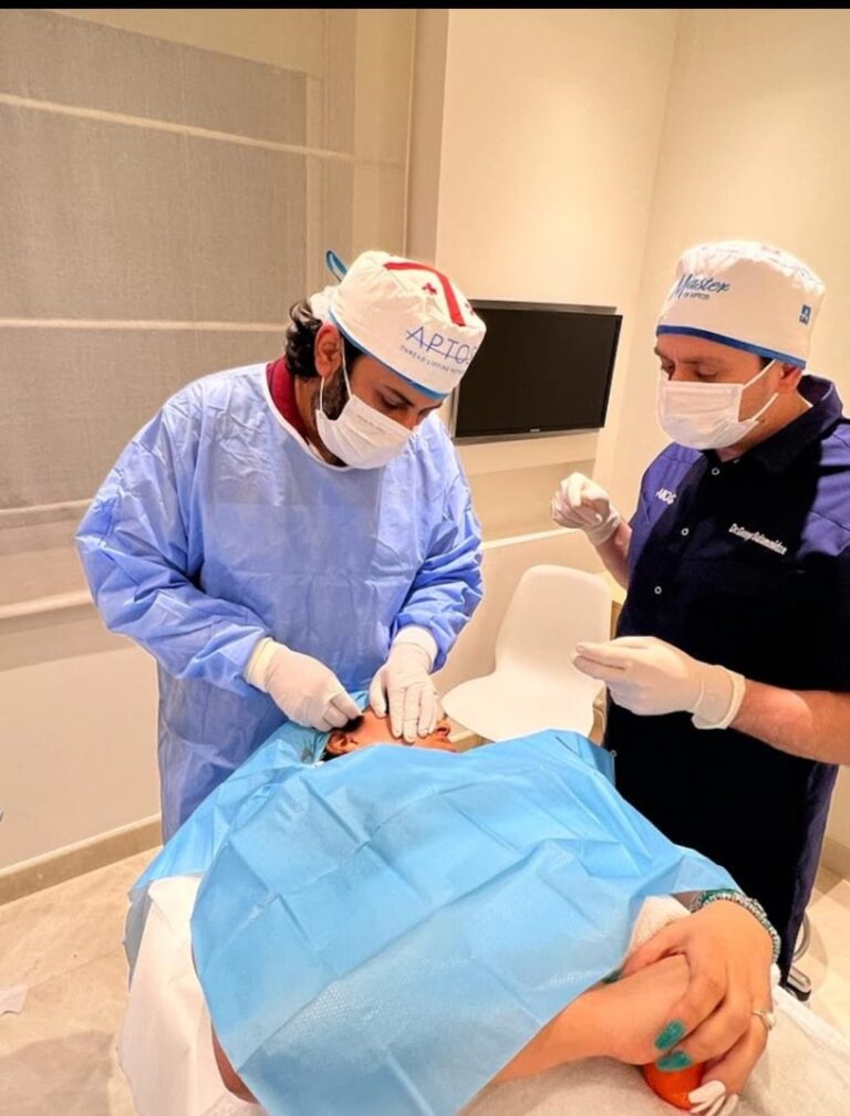 Dr Ozair Khan operating patient at Estheticare Clinic in Islamabad